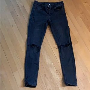 Faded Black Jeans with rips at the Knees